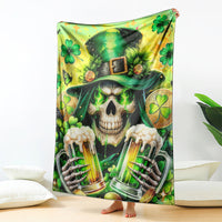Green skull-themed throw blanket with beer bottles, clovers, and shamrock hat motif