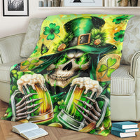 Green skull blanket with shamrock hat, clovers, and two beer-glass bottles artwork