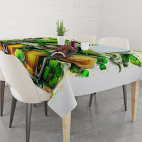 Green shamrock and beer bottle print tablecloth on a dining table with chairs