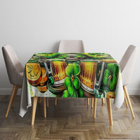 Rectangular green beer and shamrock print tablecloth on a table with four chairs