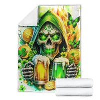 White skull and beer bottle throw blanket, folded with stacked white towels