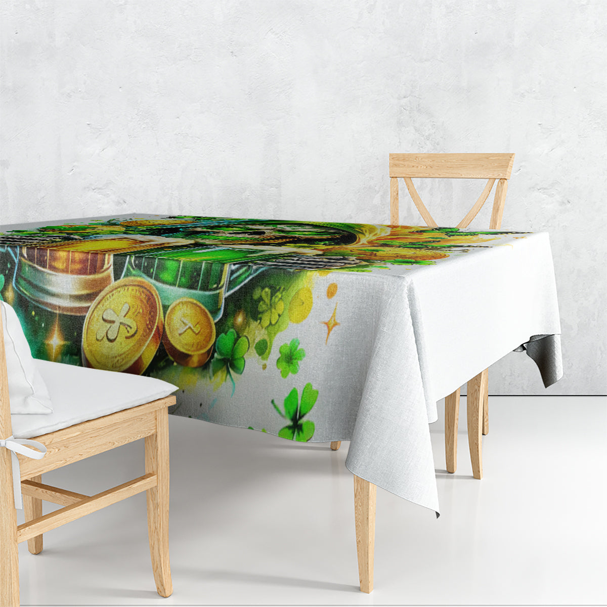 White printed tablecloth on dining table edge, green beer and clover coins motif