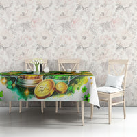 White printed tablecloth on bench table, green beer and gold coins clover artwork