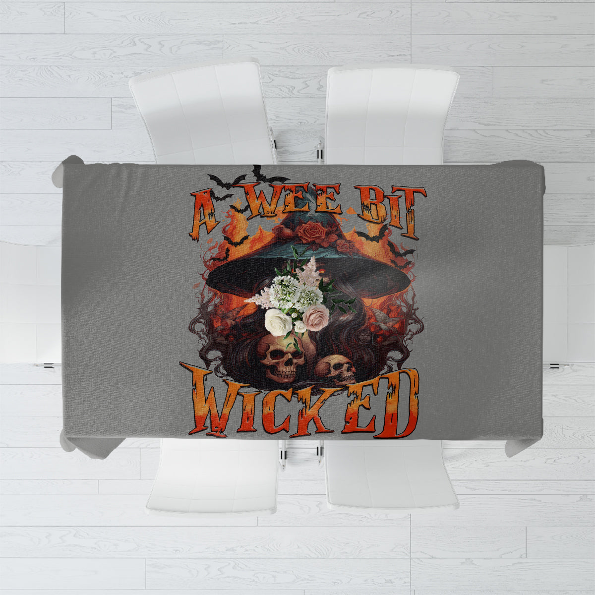 Gray tablecloth with “Wee Bit Wicked” witch skull design centered