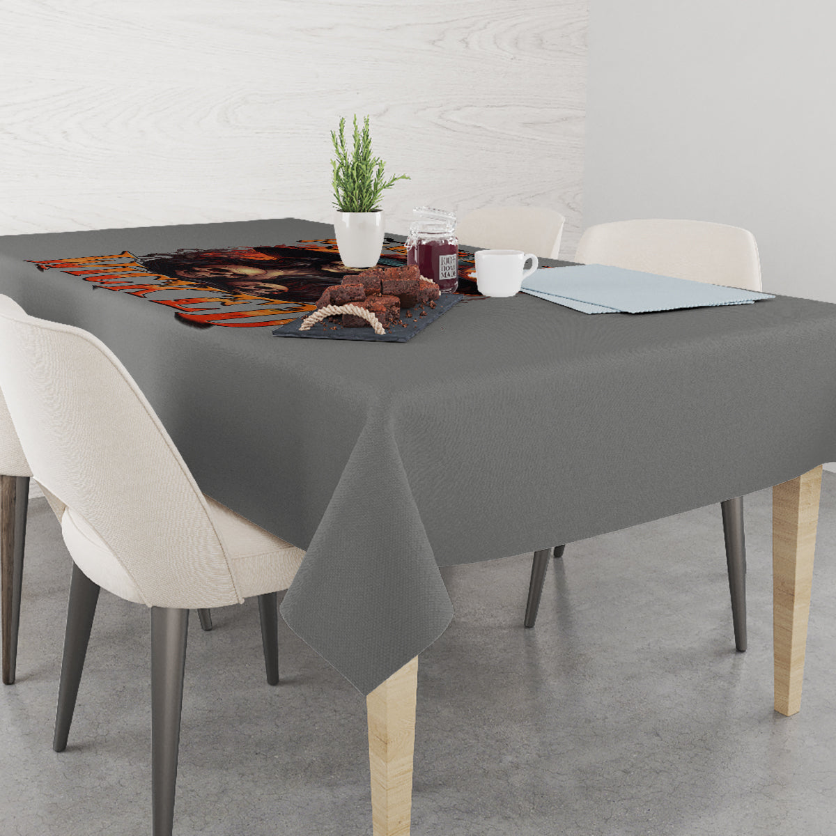Gray tablecloth with orange witch skull Halloween print on tabletop edge