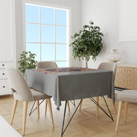 Gray tablecloth with Halloween witch skull print on dining table, top view