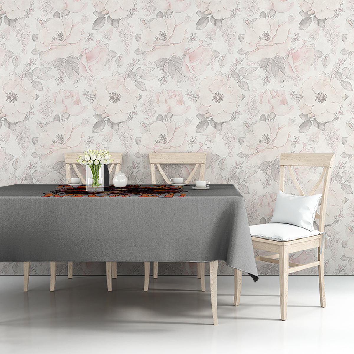 Gray tablecloth with witch skull Halloween graphic along table length, side view