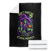 Black witch skull blanket with neon 'GET THE FLYING MONKEY' graphic and folded stacks