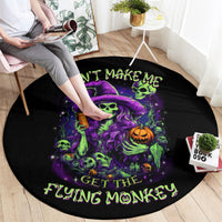 Black round rug with purple skulls, witch hat, pumpkin, and green text graphic