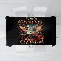 Black tablecloth featuring colorful skull, wings, and glowing decorative text