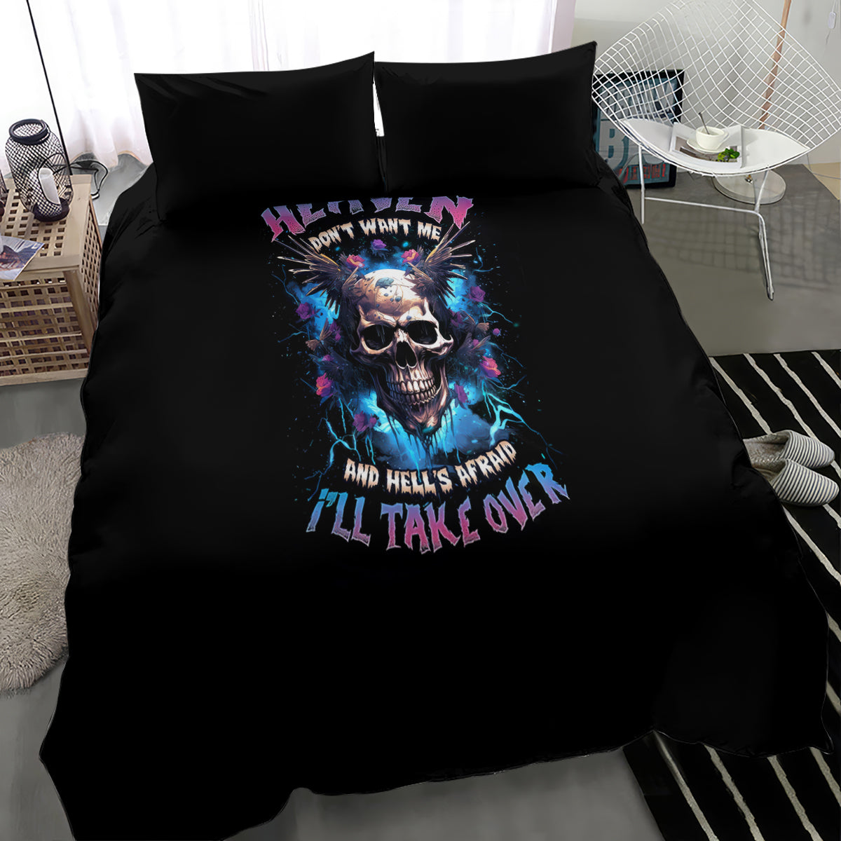 Black bed duvet with blue-red skull print and 'I'LL TAKE OVER' lettering, two pillows