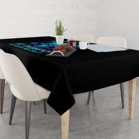 Black tablecloth with blue flame skull artwork along the center edge on a rectangular table