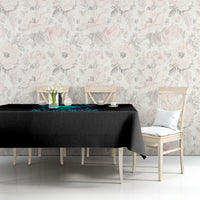 Black tablecloth covering a dining table with blue flame skull graphic at the front edge