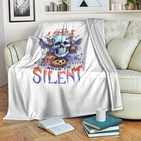 White throw blanket with bat skull graphic and “Silent” text, on sofa seat