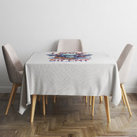 White tablecloth with colorful bat skull graphic centered on the tabletop