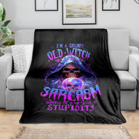 Black blanket with purple witch skull graphic, grumpy witch design