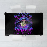 Black tablecloth featuring a purple skull design with decorative lettering