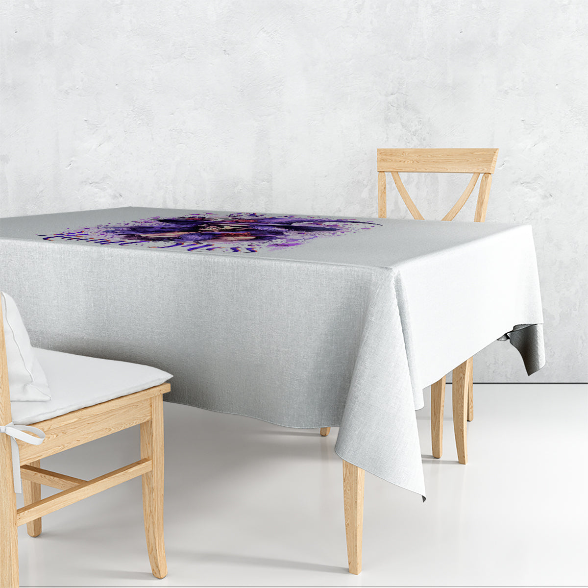 White tablecloth with purple witch skull and I'm A Haunt Mess print, corner view