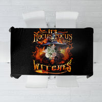 Black tablecloth on display with central flaming skull and Hocus Pocus Witches text.