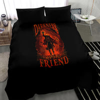 Black bedding set with orange text and skull-figure graphic on duvet, two pillows