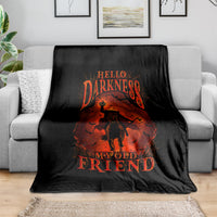 Black fleece throw blanket with orange skull jack-o-lantern graphic and 'Hello Darkness' text