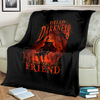 Black blanket over couch with orange skull jack-o-lantern artwork and 'Hello Darkness' lettering