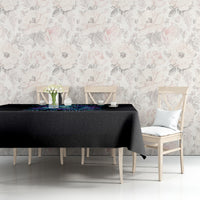 Black skull tablecloth on table edge with teal-blue floral skull pattern