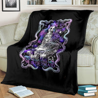 Black mermaid skull blanket on couch with purple and white artwork
