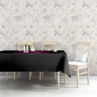 Black tablecloth with purple skull-and-roses graphic on dining table