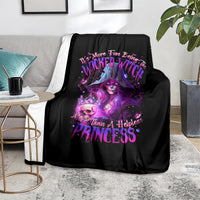 Black witch-themed blanket with purple Wicked Witch Princess graphic, over sofa arm