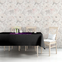 Black tablecloth with purple witch skull graphic, draped over table edge