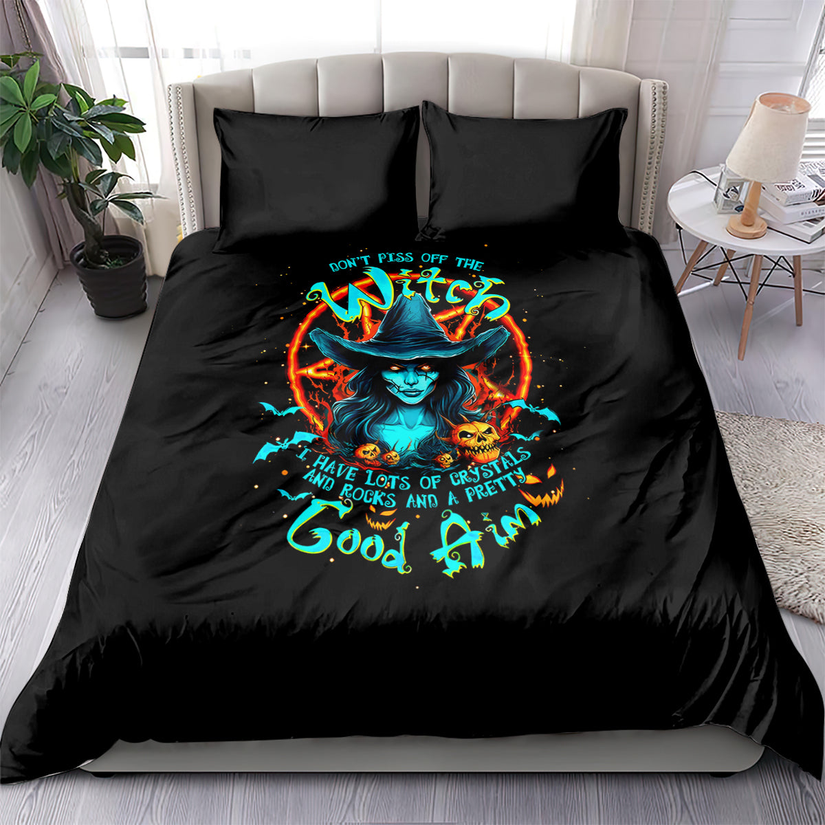 Black bedding set with two pillows and glowing witch graphic on comforter
