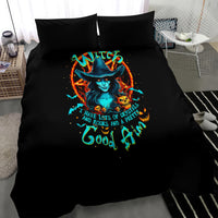 Black bedding set with two pillows and witch artwork on duvet