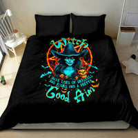 Black bedding set with two pillows and colorful witch-skull graphic on comforter
