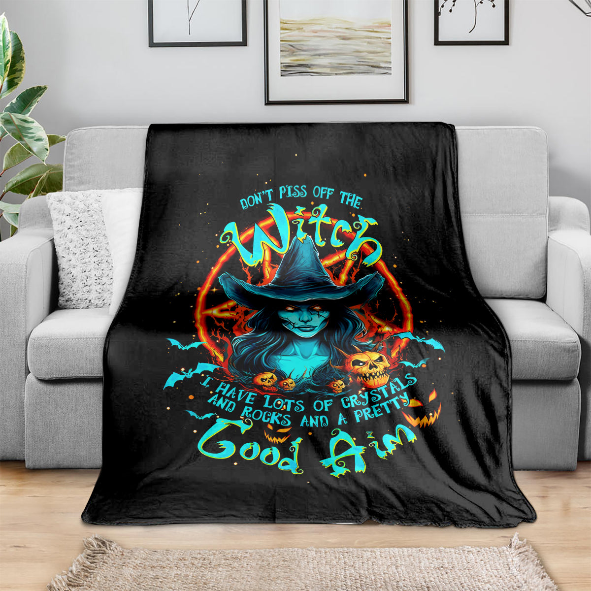 Black witch-themed skull blanket with colorful fiery witch face graphic