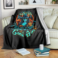Black witch skull blanket on sofa with matching colorful witch and skull print