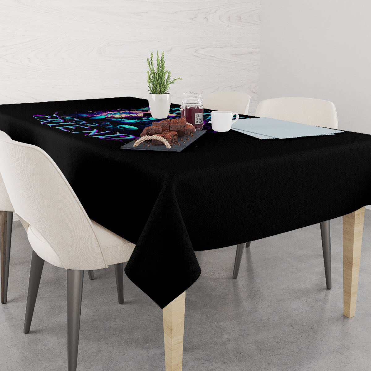 Black tablecloth on dining table with purple and blue skull design