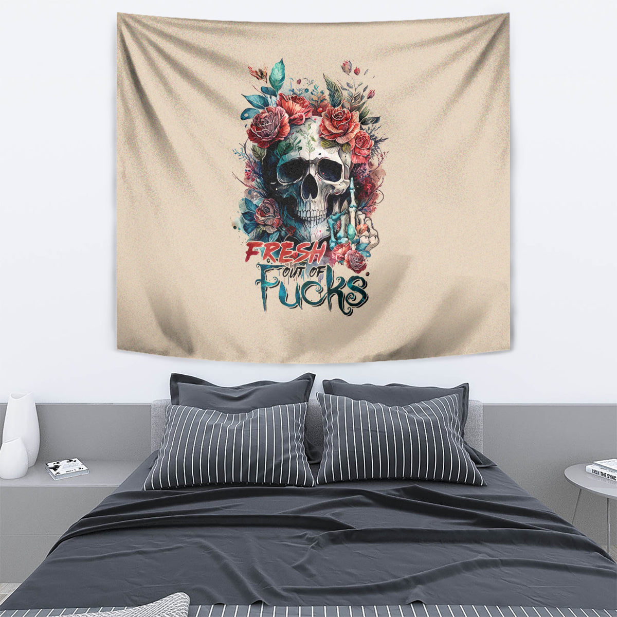Beige wall tapestry with floral skull graphic and colorful text design