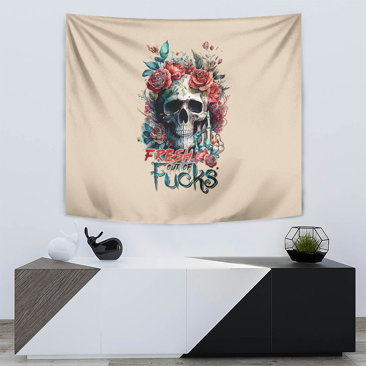 Beige tapestry with centered floral skull illustration and multicolor text