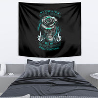 Black wall tapestry with teal skull and rose graphic, hanging above bed