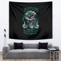 Black tapestry with teal skull and rose graphic, hung above couch