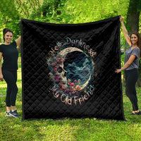 Black quilt laid flat outdoors with moon skull graphic and Hello Darkness lettering