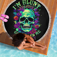 Black circular beach blanket with fringe, neon skull and floral graphic