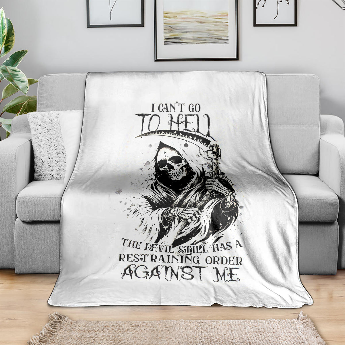 White skull reaper graphic blanket with black skull-and-lettering print