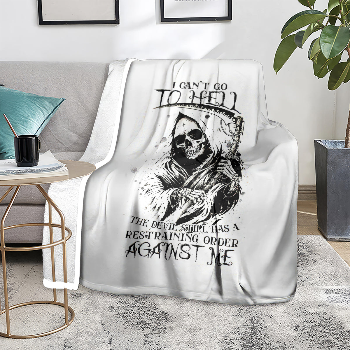 White skull reaper graphic blanket with black skull, staff, and slogan lettering