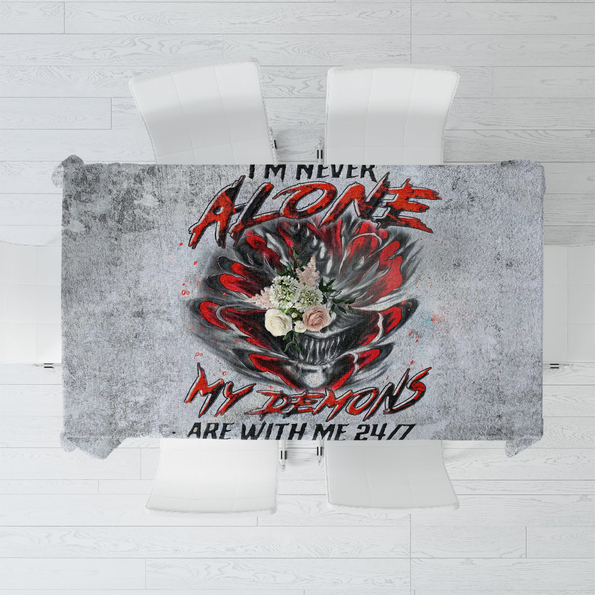 Grey tablecloth with centered devil skull graphic in red and black, text below