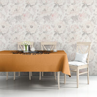 Orange tablecloth with floral skull print on table front