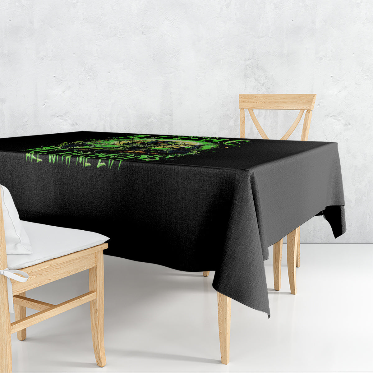 Black tablecloth with neon green zombie skull graphic across the center.