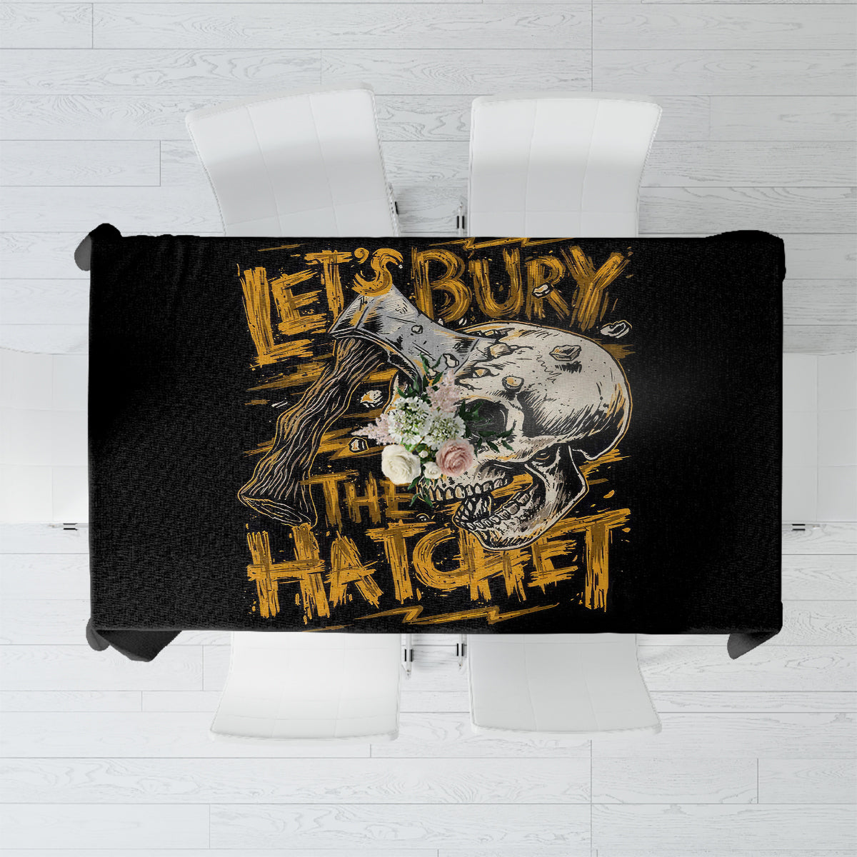 Black tablecloth laid flat, showing a large axe skull graphic with yellow accents