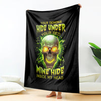 Black blanket draped over bed with green glowing skull print and “Mine Hide” text
